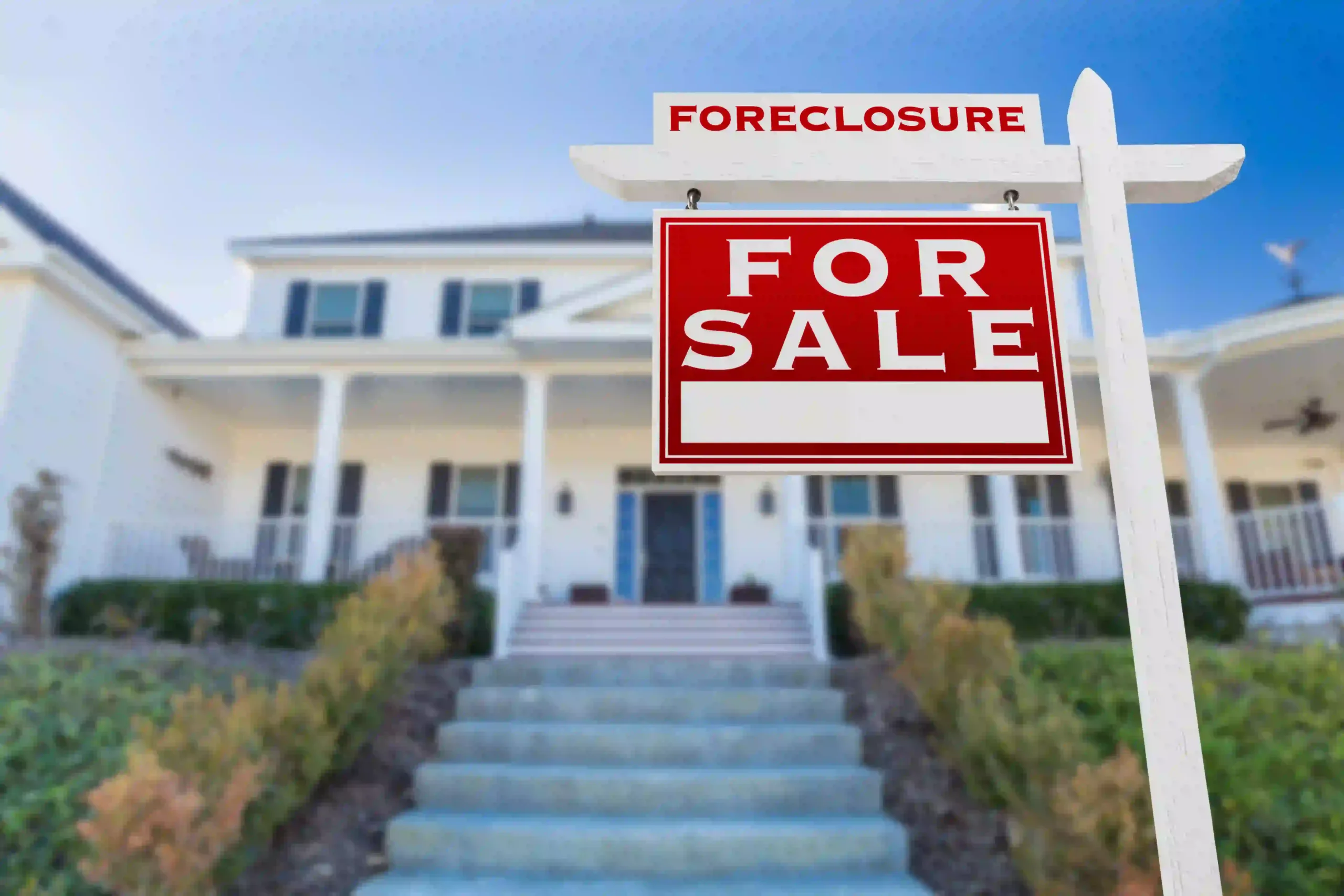 Foreclosure For Sale Sign House with foreclosure for sale sign